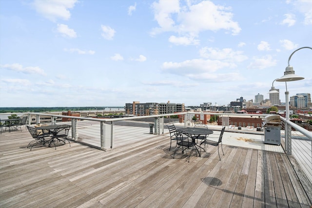 wooden terrace featuring a view of city