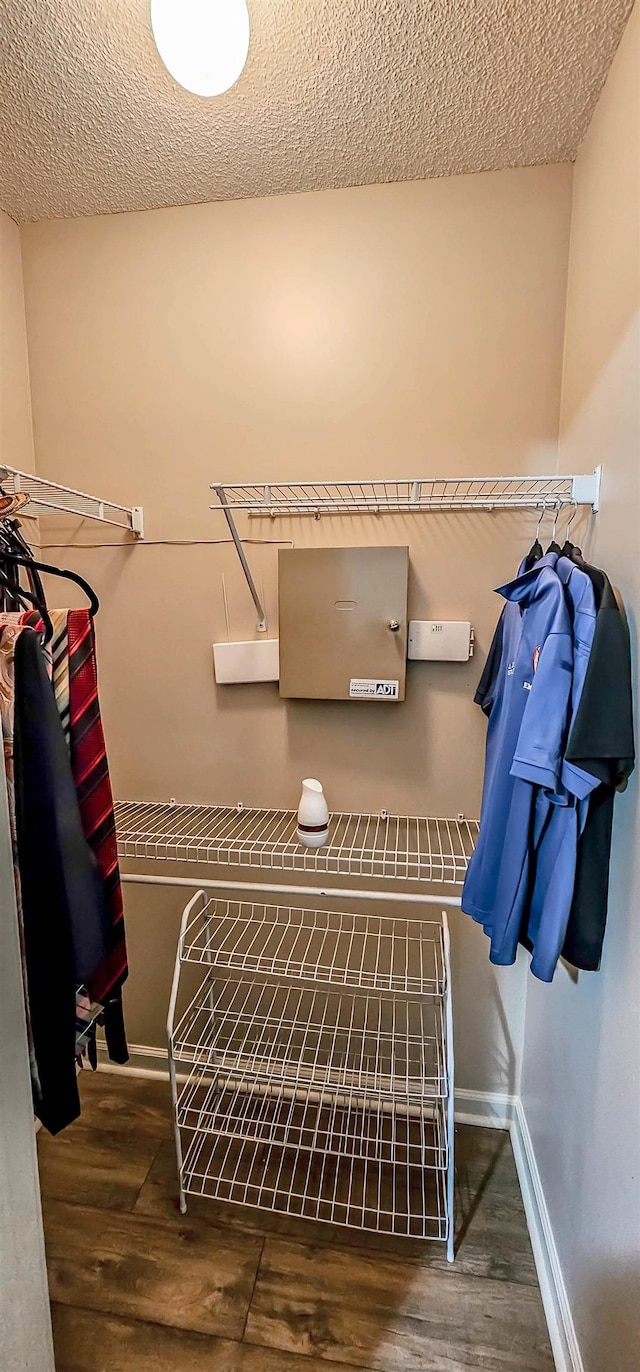 spacious closet with wood finished floors