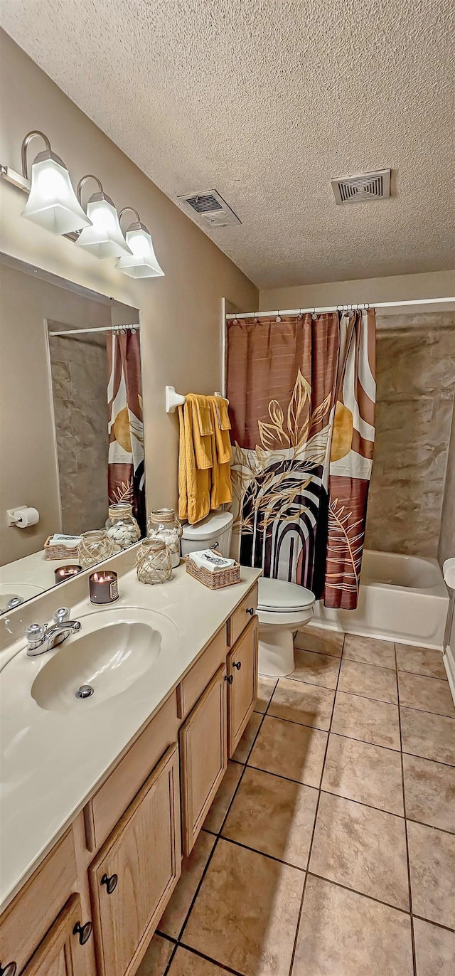 full bath featuring toilet, tile patterned flooring, visible vents, and vanity