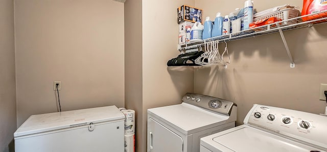 washroom featuring laundry area and washer and clothes dryer