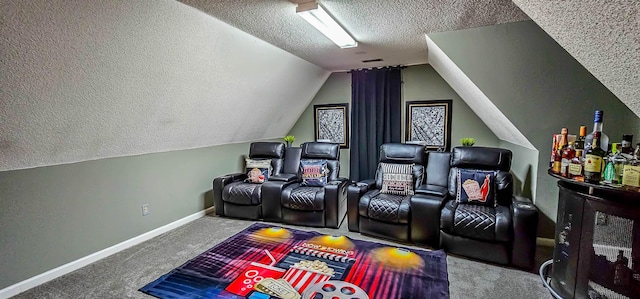 home theater with visible vents, carpet flooring, vaulted ceiling, a textured ceiling, and baseboards