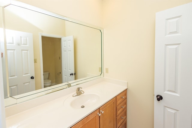 bathroom with vanity and toilet