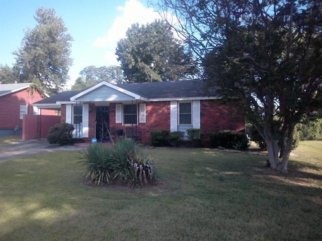 single story home with a front yard and brick siding