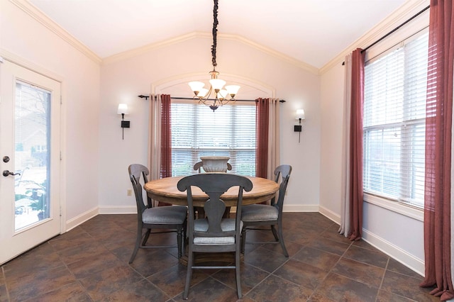 dining room featuring ornamental molding, a chandelier, a healthy amount of sunlight, and vaulted ceiling