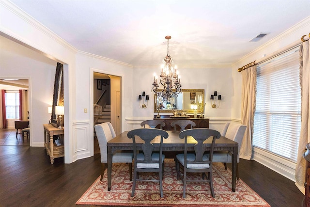 dining area with stairway, visible vents, dark wood-type flooring, and an inviting chandelier