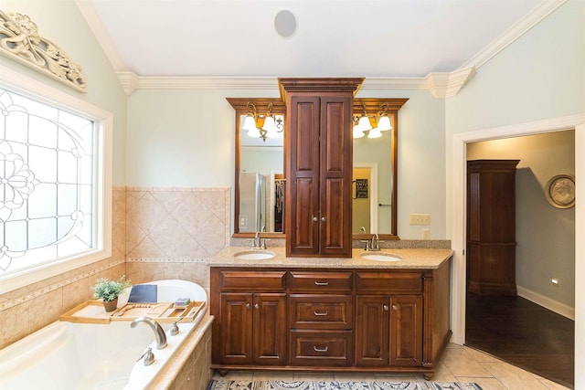 full bathroom featuring ornamental molding, a garden tub, a sink, and double vanity