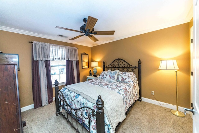 bedroom featuring carpet flooring, crown molding, visible vents, and baseboards