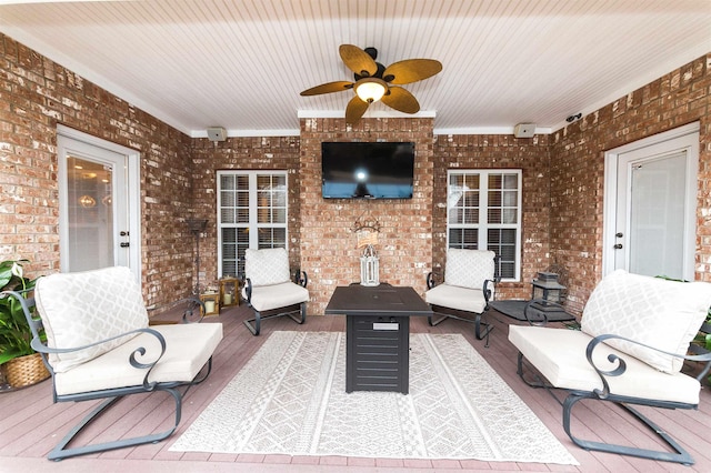 view of patio / terrace featuring a ceiling fan, a deck, and an outdoor hangout area