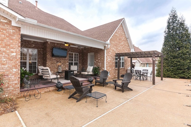 view of patio featuring a ceiling fan, outdoor dining area, and a pergola