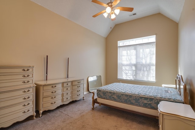 bedroom with lofted ceiling, ceiling fan, light carpet, and visible vents