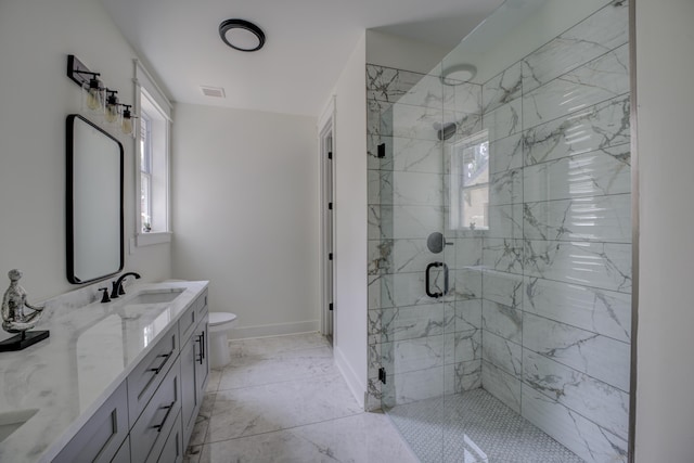 bathroom featuring a sink, visible vents, baseboards, marble finish floor, and a stall shower