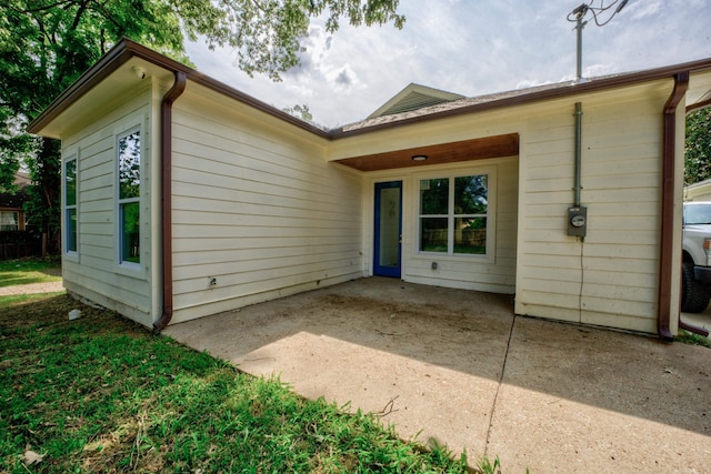 back of property featuring a patio area