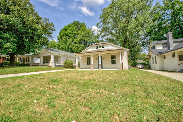 bungalow-style house featuring a porch and a front yard