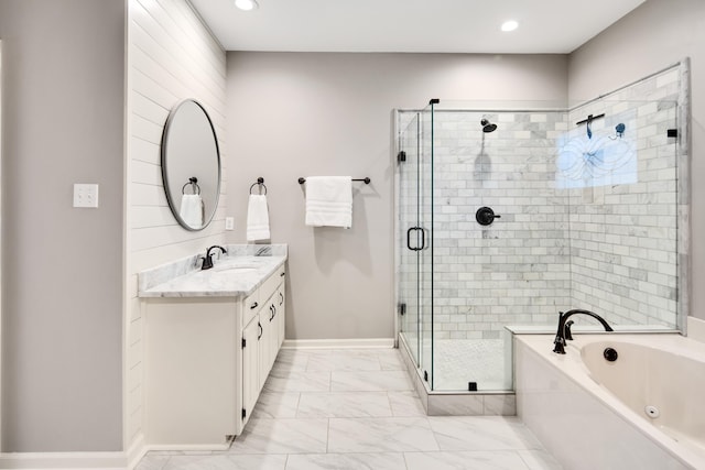 full bath featuring vanity, baseboards, marble finish floor, a bath, and a stall shower