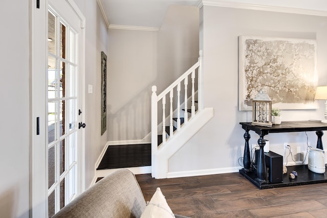 entryway with stairway, baseboards, crown molding, and wood finished floors