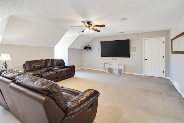 carpeted living room featuring a textured ceiling, baseboards, vaulted ceiling, and a ceiling fan