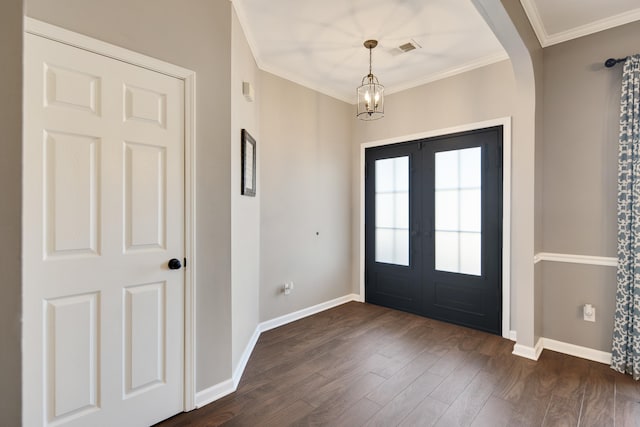 foyer with baseboards, crown molding, visible vents, and dark wood-type flooring