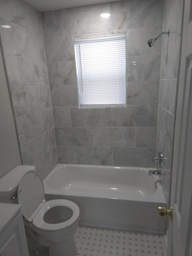 bathroom featuring bathing tub / shower combination, vanity, and toilet