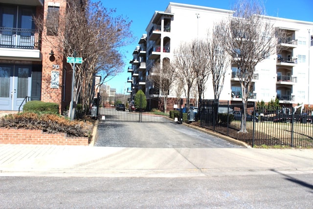 view of road featuring a gate and a gated entry