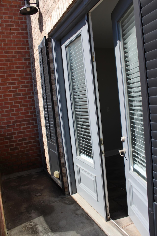 entrance to property with brick siding