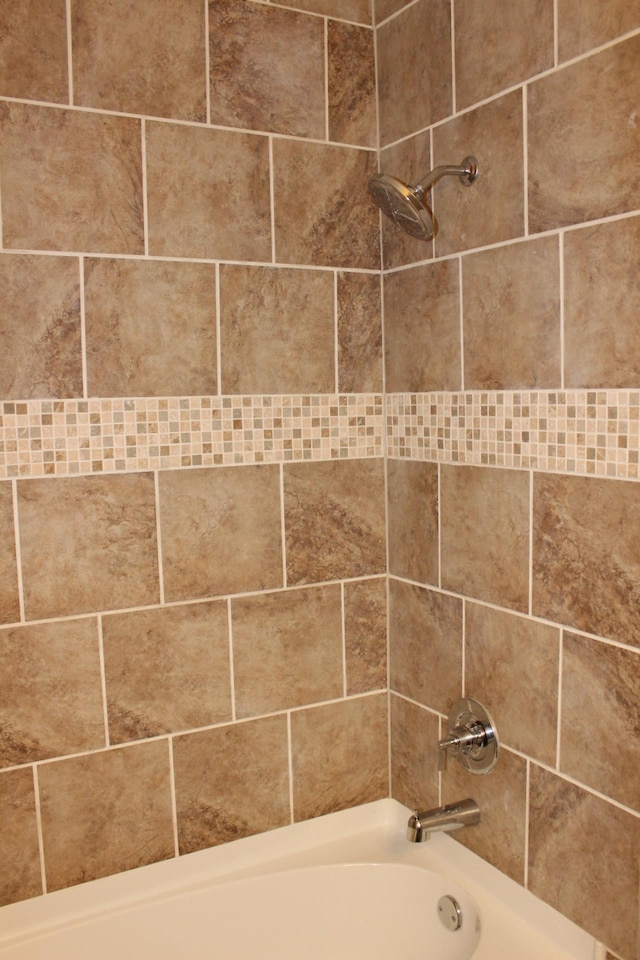 interior details featuring bathing tub / shower combination