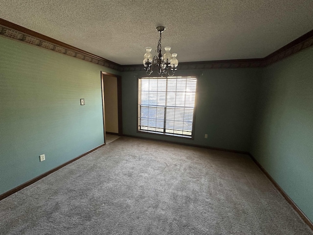 unfurnished room with a chandelier, carpet, a textured ceiling, and baseboards