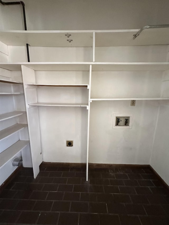 clothes washing area featuring washer hookup, laundry area, electric dryer hookup, and brick patterned floor