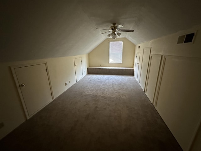 additional living space featuring vaulted ceiling, ceiling fan, carpet, and visible vents