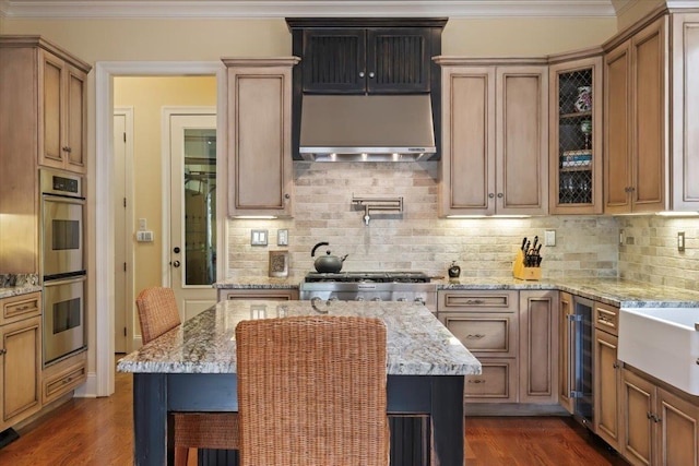 kitchen featuring crown molding, dark wood finished floors, tasteful backsplash, glass insert cabinets, and stainless steel double oven