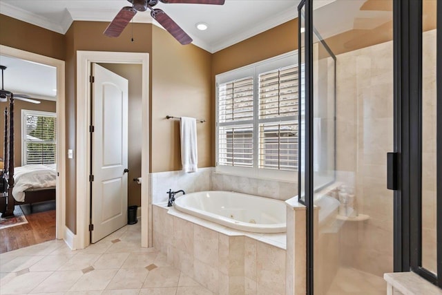 ensuite bathroom with tile patterned flooring, ornamental molding, a jetted tub, a shower stall, and ensuite bath