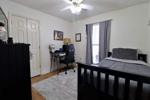 bedroom featuring light wood-type flooring and a ceiling fan