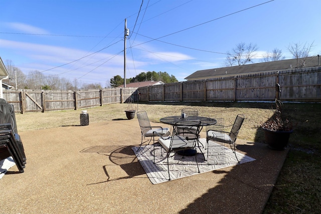 view of patio / terrace with outdoor dining space and a fenced backyard