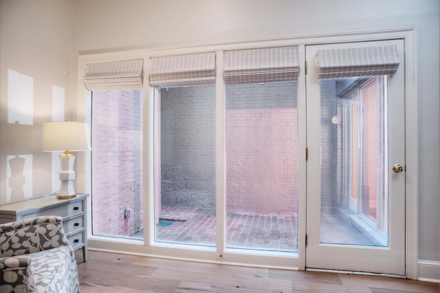 doorway featuring wood finished floors