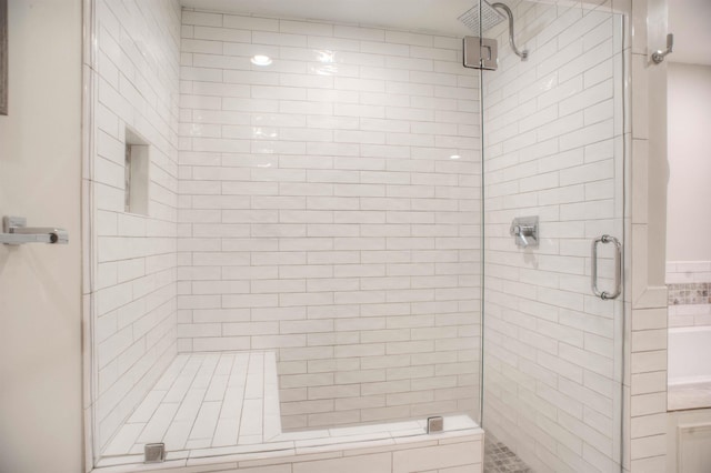 bathroom featuring a shower stall