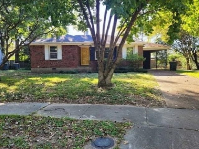 ranch-style house with concrete driveway, crawl space, a front lawn, a carport, and brick siding