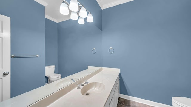 bathroom with baseboards, crown molding, vanity, and toilet