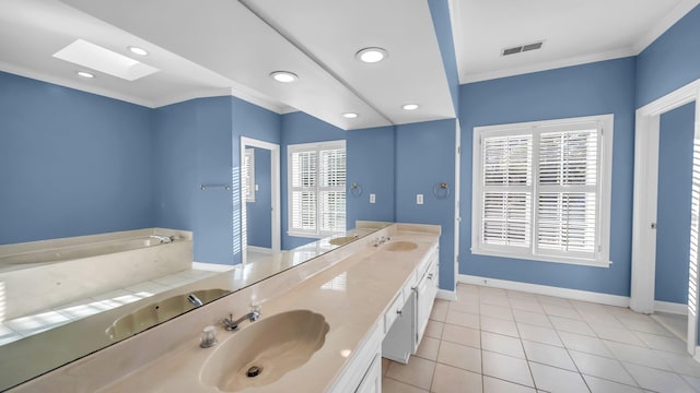 full bath with ornamental molding, a skylight, visible vents, and a sink