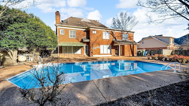 view of pool featuring a patio area, fence, and a fenced in pool