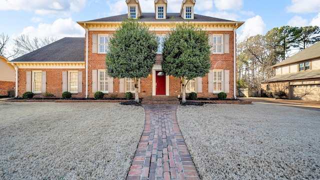 colonial house with brick siding