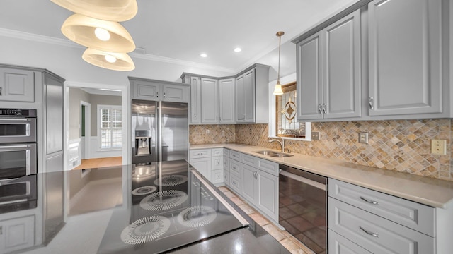 kitchen with appliances with stainless steel finishes, gray cabinets, and crown molding