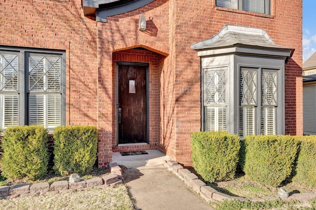 property entrance with brick siding