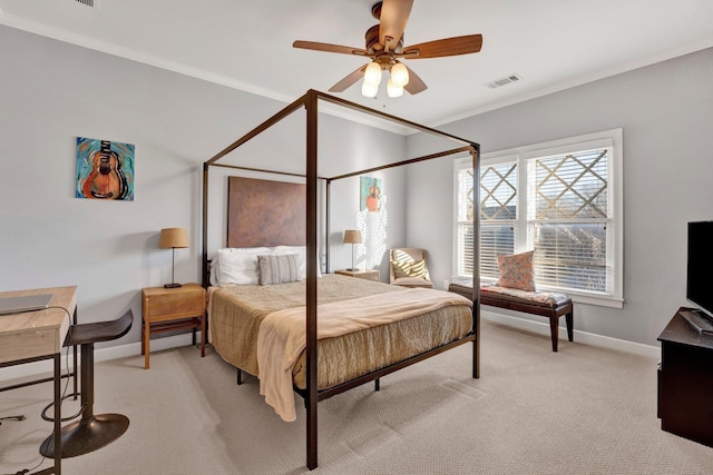 bedroom with light colored carpet, a ceiling fan, visible vents, baseboards, and ornamental molding