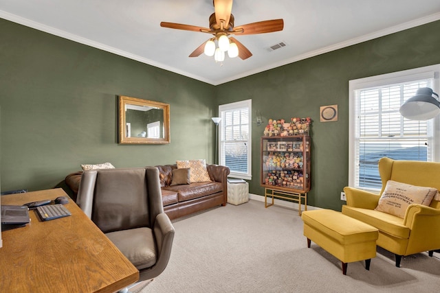 home office featuring ornamental molding, a healthy amount of sunlight, visible vents, and carpet flooring