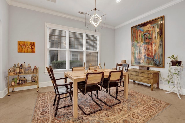 dining space featuring light tile patterned floors, baseboards, a chandelier, and crown molding