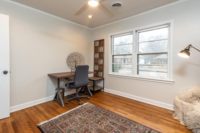 office area with baseboards, visible vents, crown molding, and wood finished floors