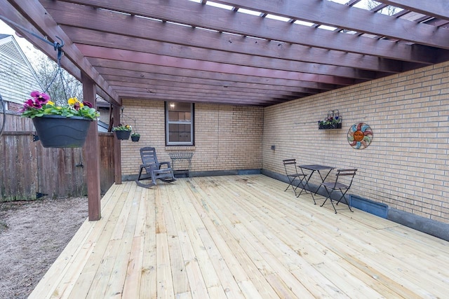 deck with fence and a pergola