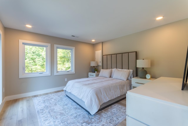 bedroom featuring recessed lighting, light wood-type flooring, and baseboards