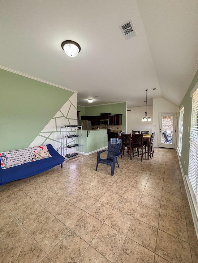 living room with lofted ceiling, ornamental molding, light tile patterned floors, and visible vents