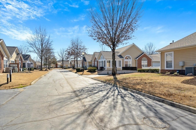 view of street with a residential view and curbs