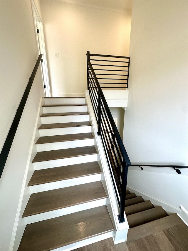 stairs with wood finished floors